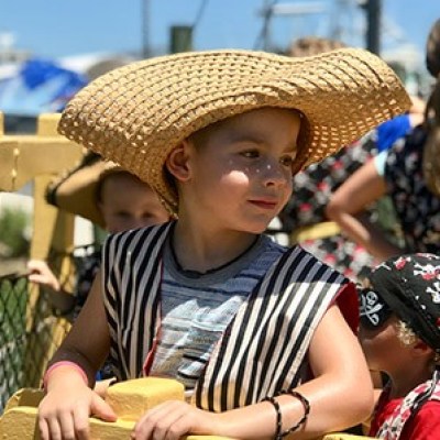 a young child wearing a hat