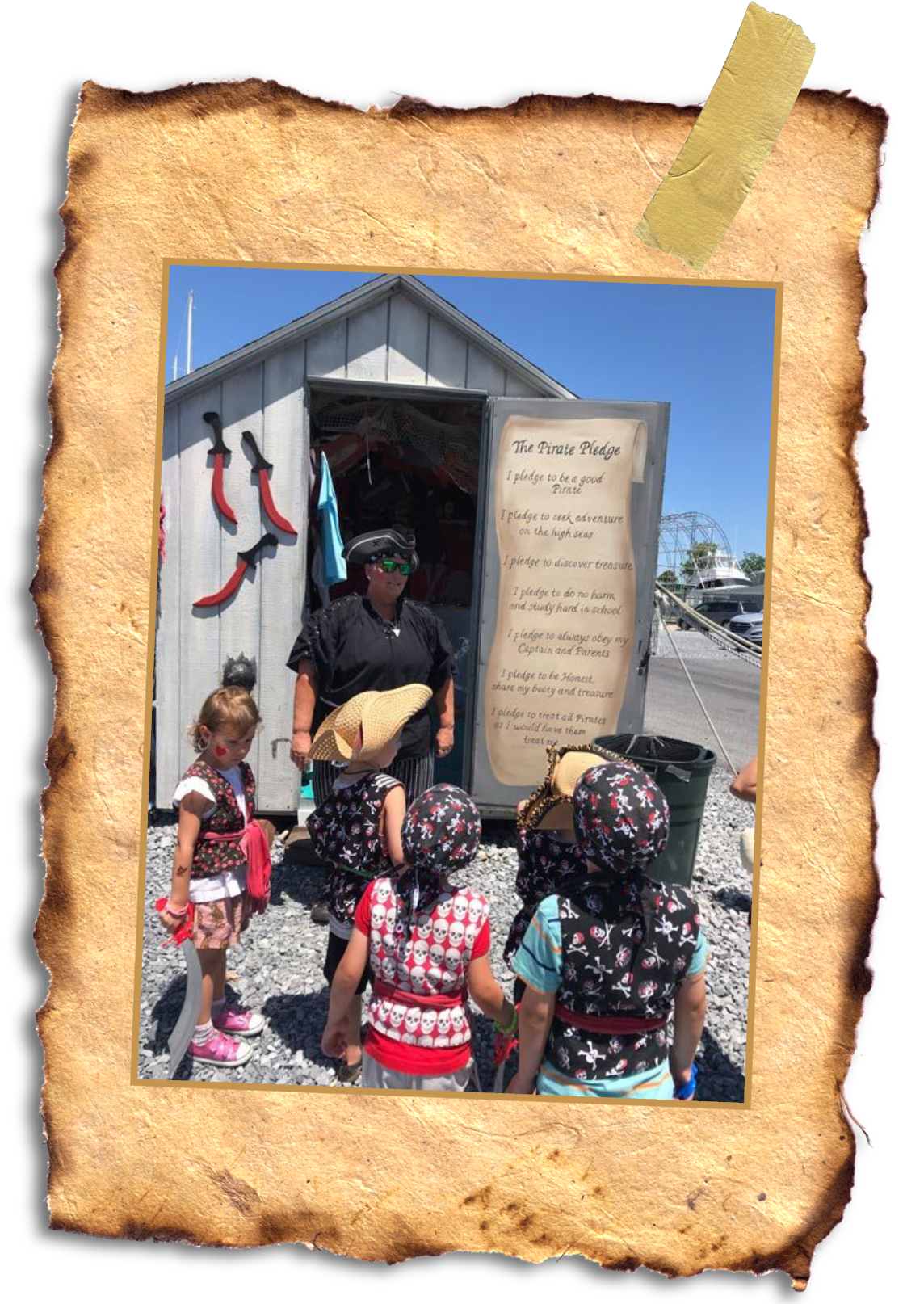 a group of people with little pirate kids posing for a picture