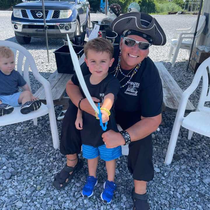 a group of people sitting posing for the camera