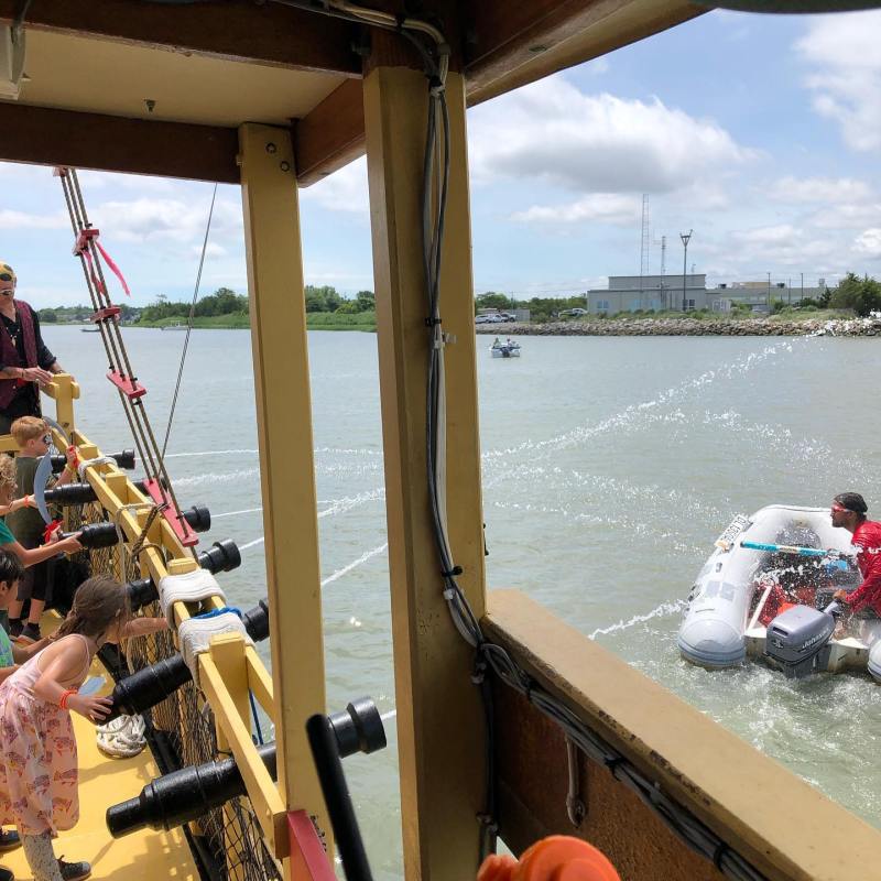 a group of people on a boat in the water